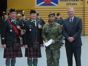 RSM Mike Lever, LCol Robert Patchett, Pte Said Yousuf, Col Neil Thompson Presentation of 13Pl Bursary 